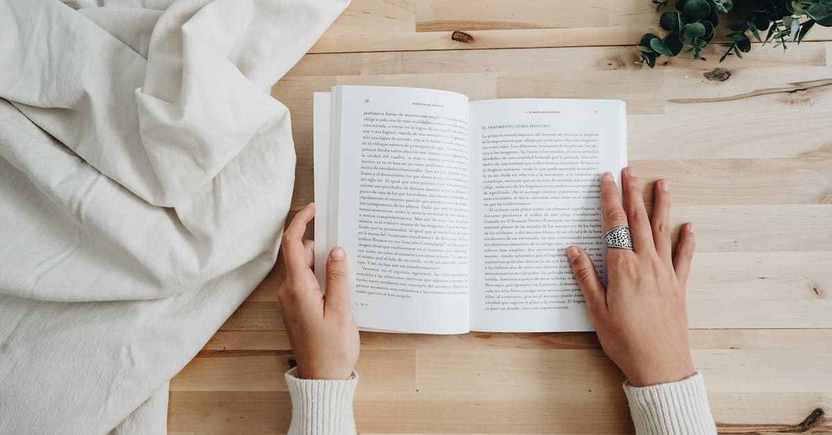 person reading manuscript to edit for publication