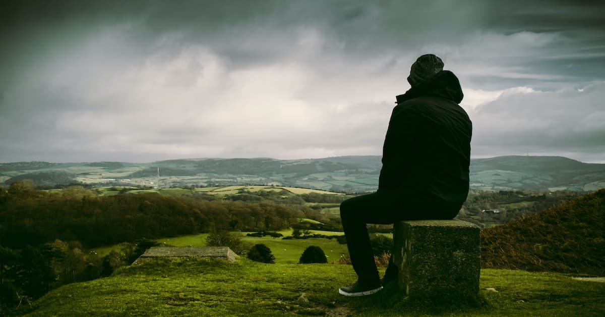 man using creative writing prompts to take walk and write poem