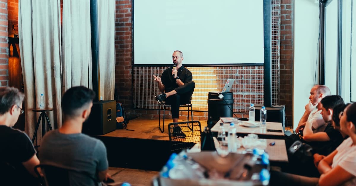 man giving a speech using an outline he wrote