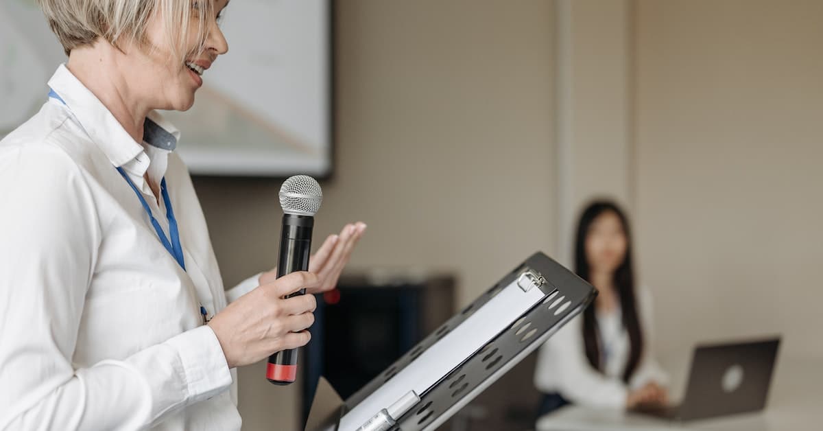 woman giving a speech using an outline